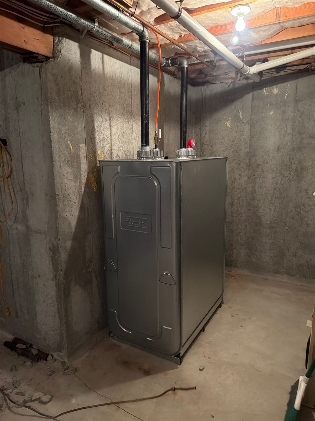 Roth double-wall oil tank installed in an unfinished basement